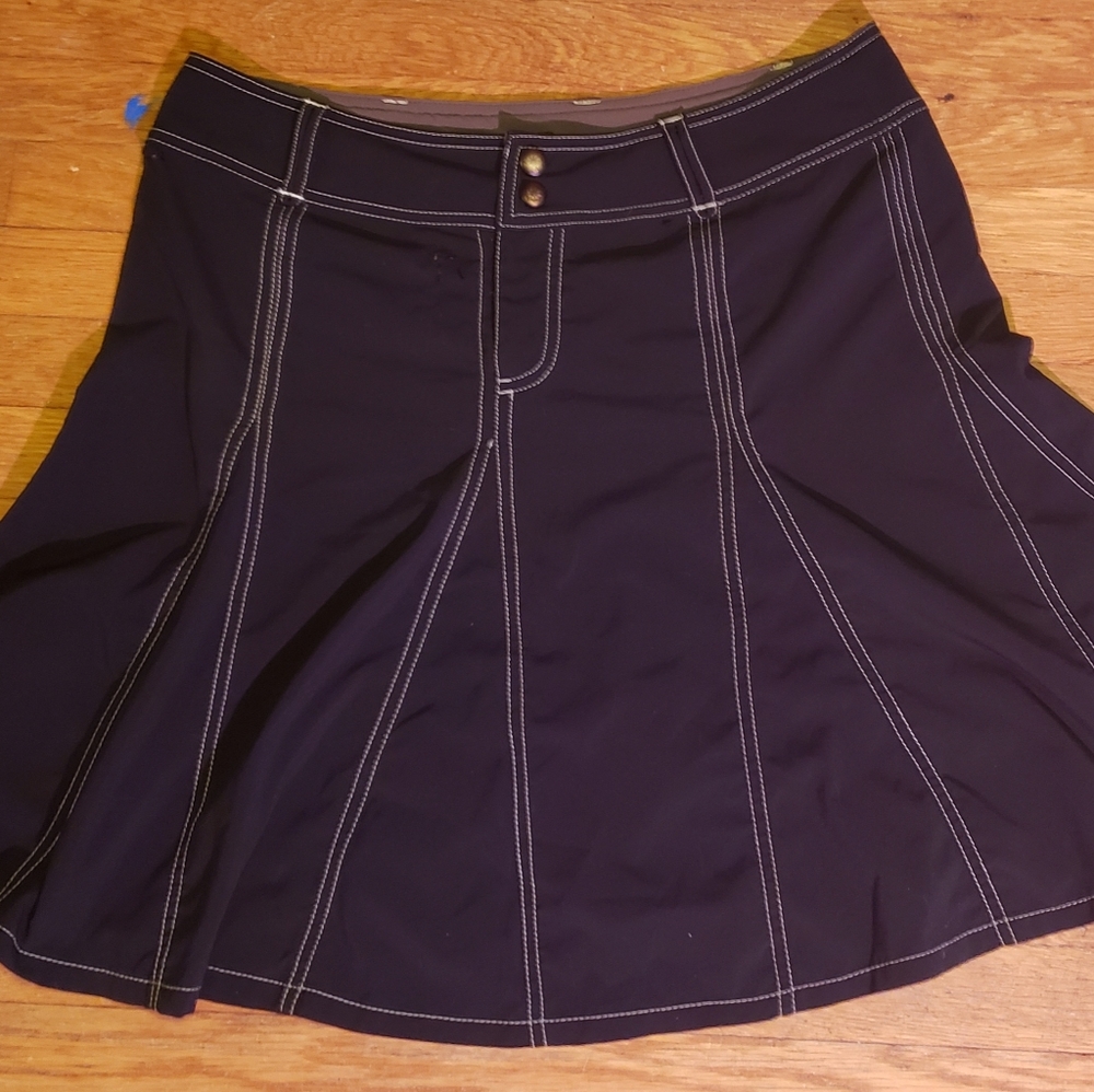 a dark brown skirt fits size 12/14 thrift find with no tags and minimal wear